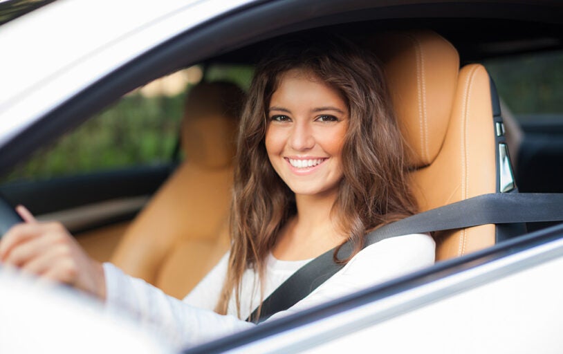 Woman sitting in the front seat of a car