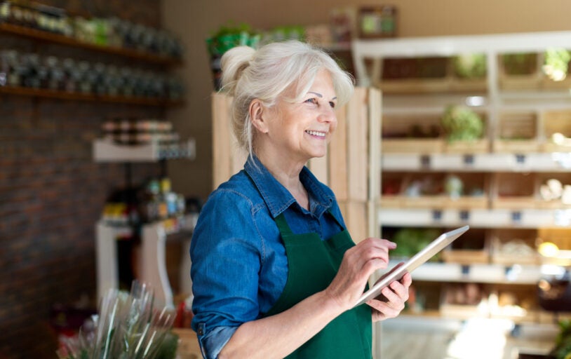 Happy business owner in their store