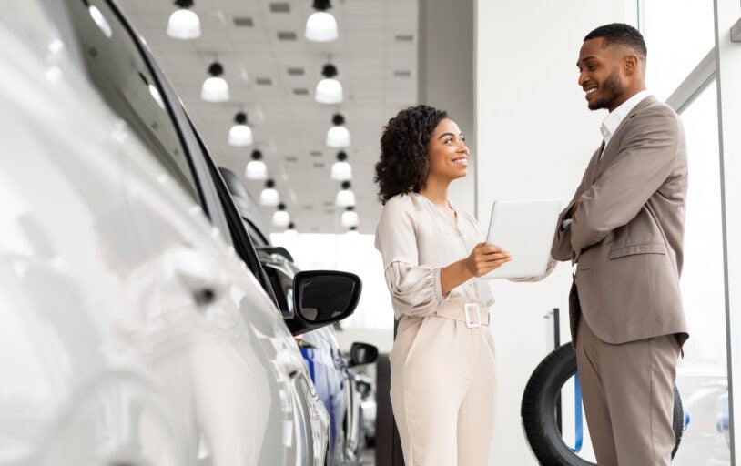 Woman at car dealership