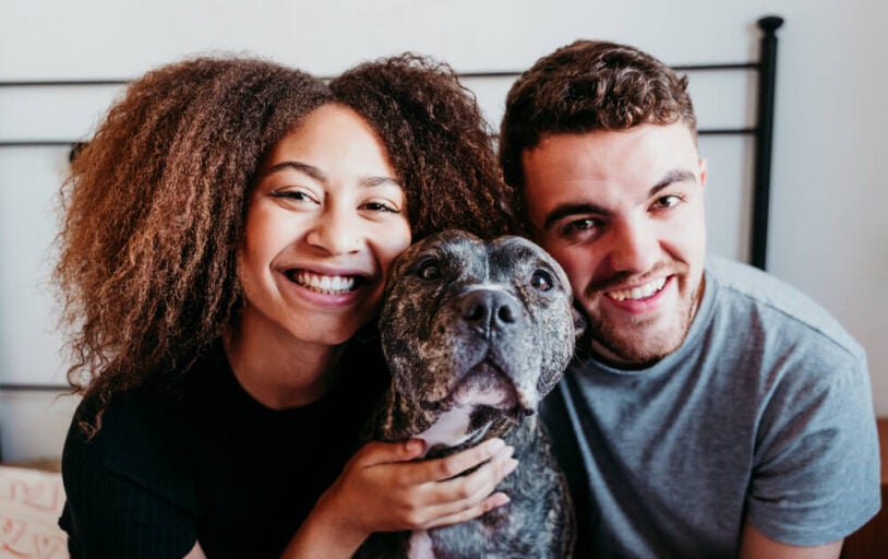 happy couple with dog