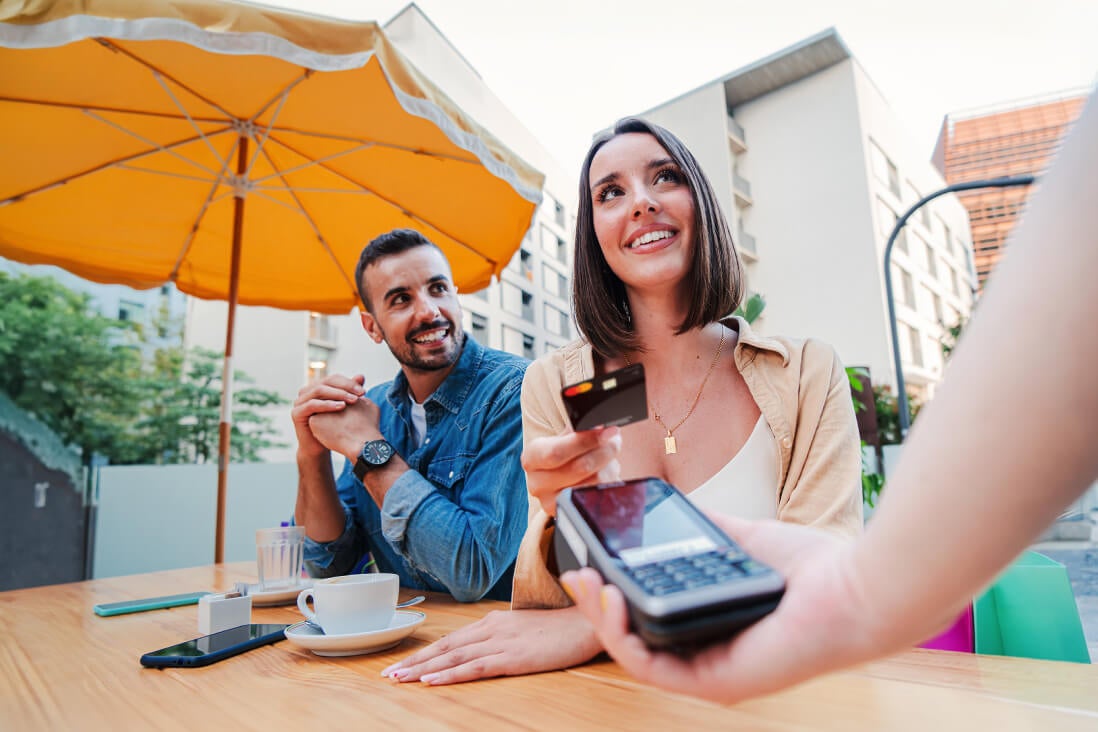 Couple paying at restaurant