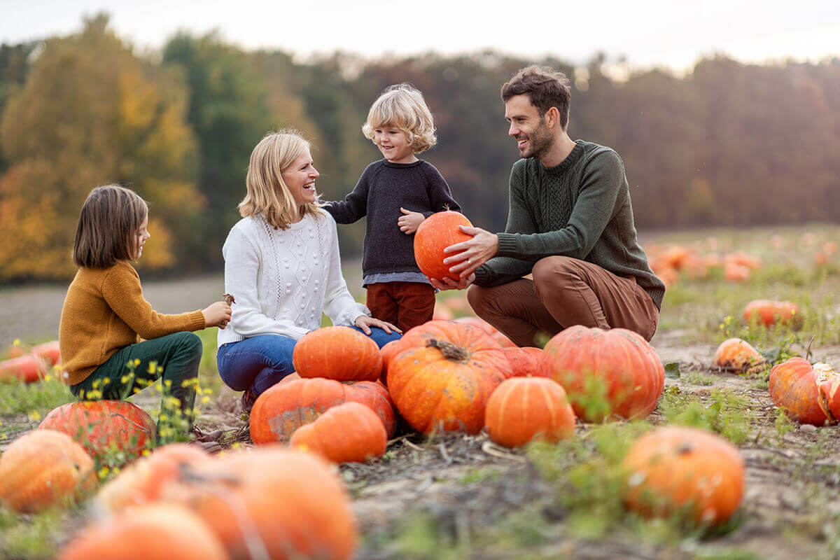 family at pumpkin patch